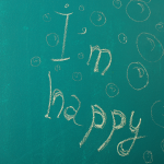 Scritta "I'm happy" su sfondo verde